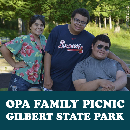 Three smiling people enjoying Gilbert Lake State Park